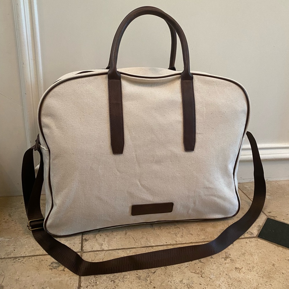 John Varvatos Canvas overnight / carry on luggage bag. Cream, brown trim. Zipper